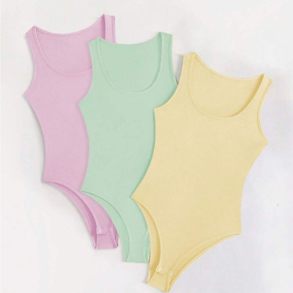 SHEIN 3pack of ribbed tank top bodysuits in pastel colors. Brand new